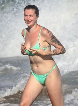 Ireland Baldwin sexy in green bikii on the beach in Malibu